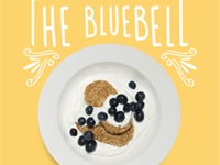 The Bluebell. Two biscuits with plain yoghurt and blueberries.